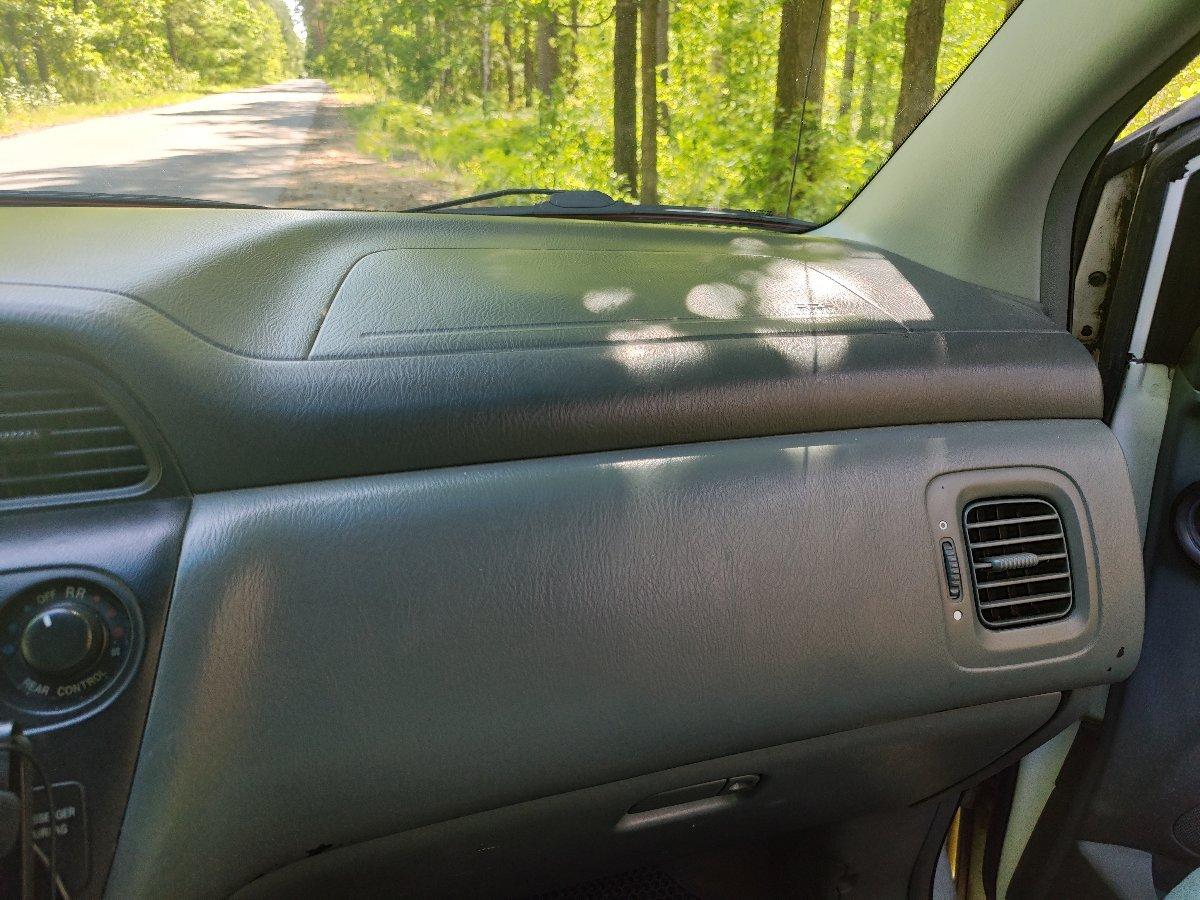 Minivan camping dashboard with Android GPS navigation and music player for road trips