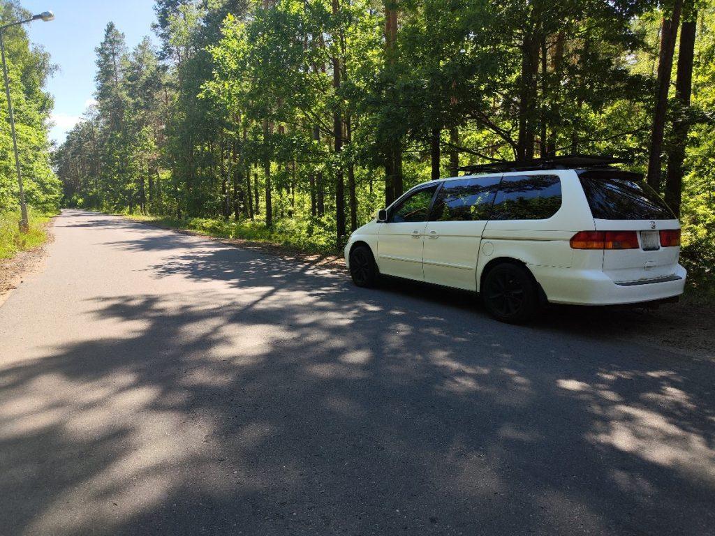 Honda Odyssey rear view with camping gear in forest